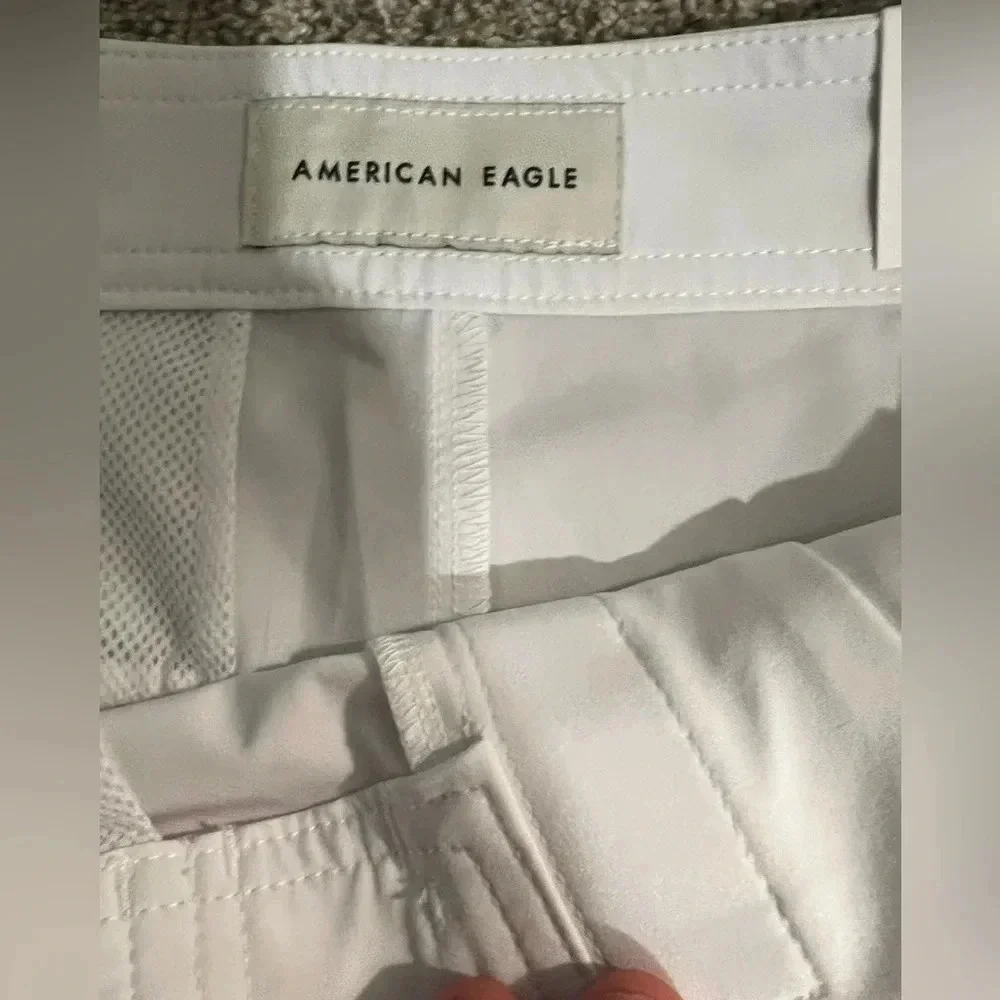 AE XS Board Shorts Brand new in white with blue and red accent colors